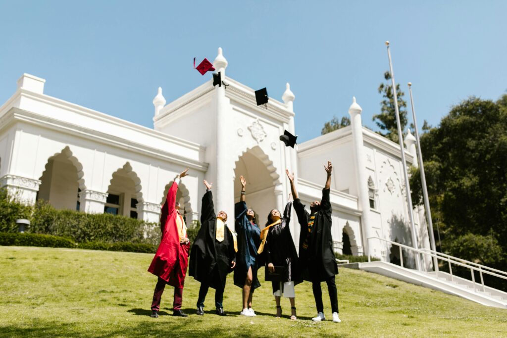 Students in graduation caps and gowns celebrating their achievements