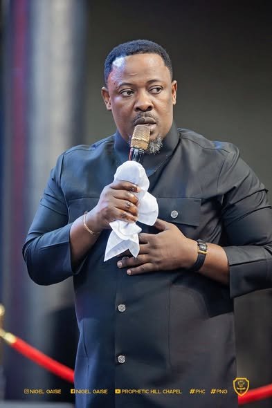 Nigel Gaisie Says No Prophet on Earth Gets 100% Accurate Prophecies Nigel Gaisie stated that some people think a prophet must always give flawless prophecies, but that idea is wrong. He said prophecy is not a machine-controlled activity where a person presses a button and everything becomes accurate. Instead, prophecy involves hearing and interpreting spiritual messages, and sometimes the interpretation may not be completely right. He added that even though he hears from God, he is still a human being with emotions, and emotions can affect how a message is delivered. He explained that if a prophet is tired, worried, or disturbed, there is a chance the prophecy may not be interpreted fully or correctly. For this reason, he believes any prophet who claims to be 100% accurate is not being truthful. Nigel Gaisie also shared that when he started his ministry many years ago, he made some mistakes because he did not have proper mentorship. He said mentorship is very important in the prophetic world, and having experienced leaders to guide young prophets helps prevent errors. He mentioned that he now follows the guidance of respected senior ministers who help him stay focused and disciplined. The prophet encouraged Ghanaians to understand that prophecy is a spiritual gift, not a guarantee of perfection. He said true prophets are sincere people who try their best to deliver God’s message, but they remain human. He advised the public not to attack prophets when a prophecy does not happen exactly as expected, because even genuine prophets can get it wrong sometimes. Nigel Gaisie concluded by saying that what matters most is honesty, humility, and a heart that truly seeks God.