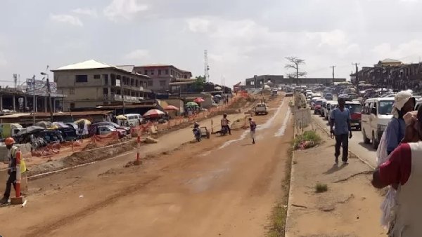 Suame main road blocked by artisans over unfinished road, health risks